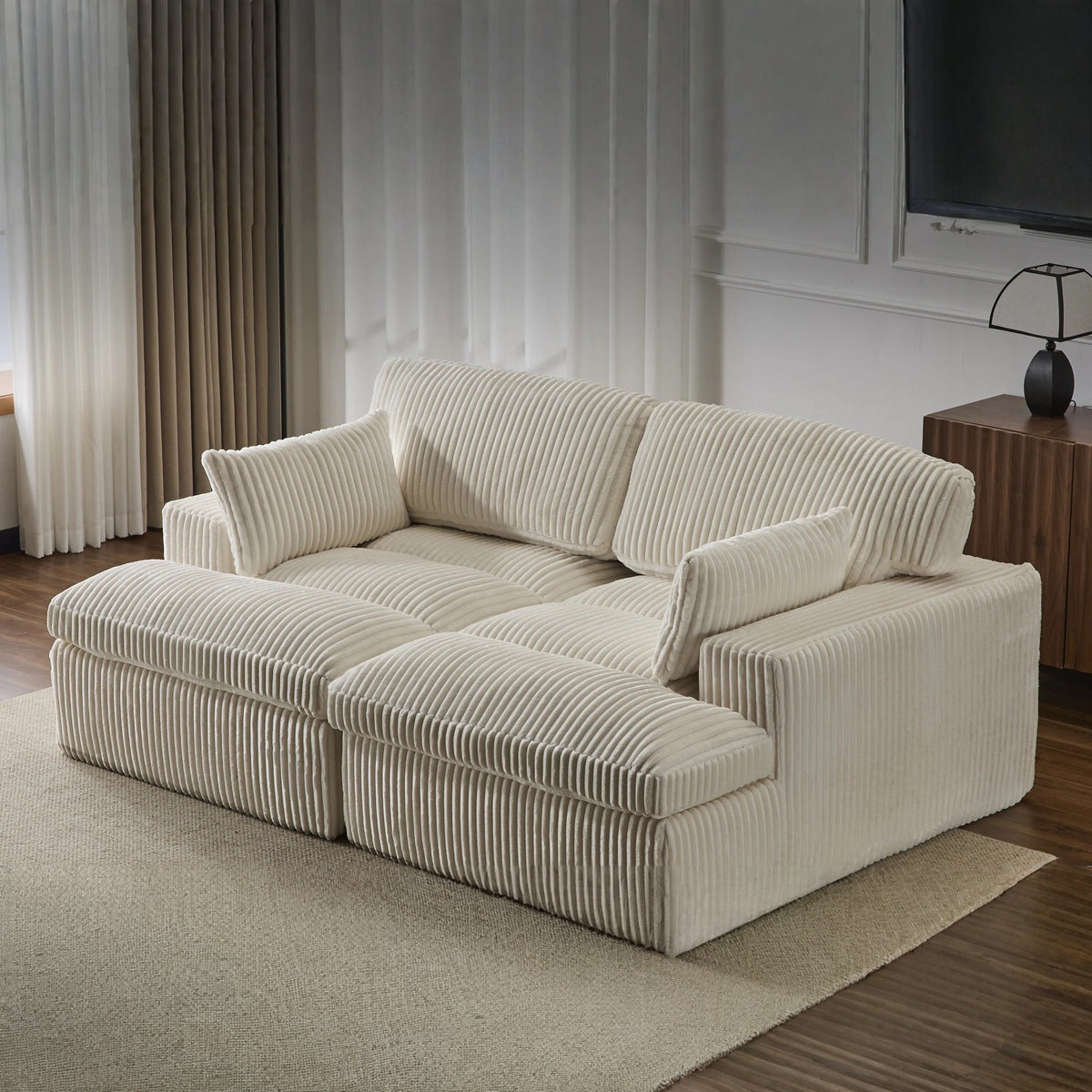 Canapé convertible 4 en 1 en velours côtelé, coloris crème, en situation, chaise longue