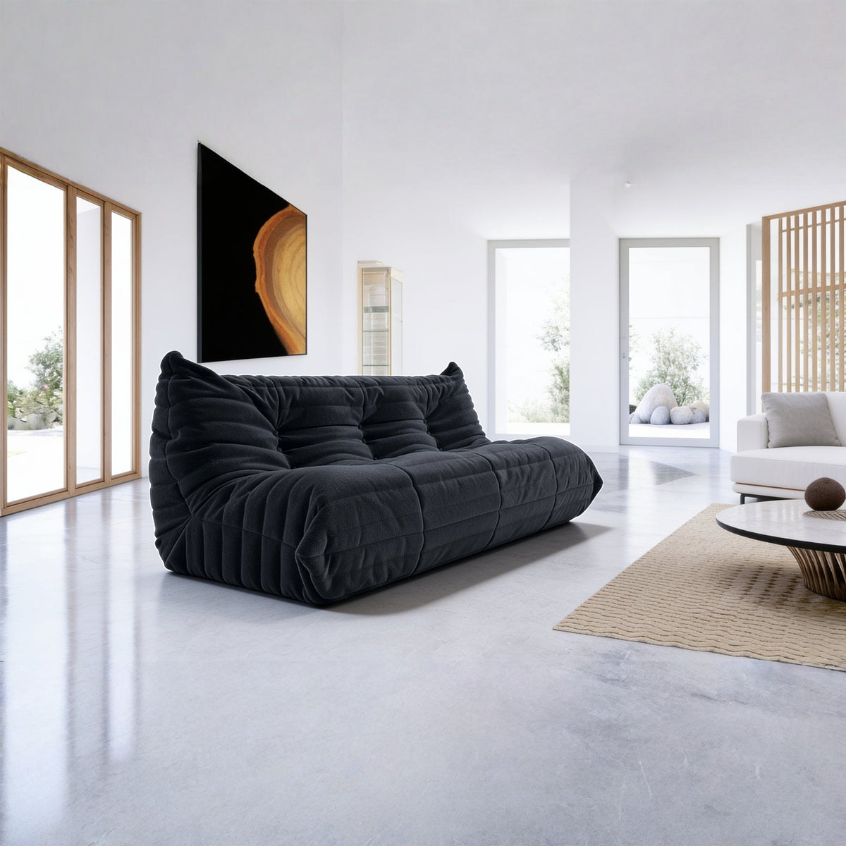 Canapé modulable bas 3 places, velours teddy noir charbon, en situation dans un intérieur