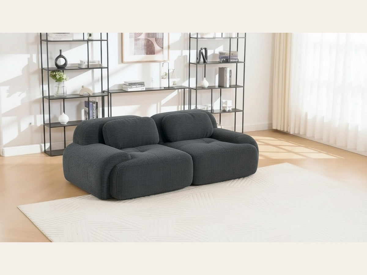 Canapé modulaire 2 places gris, de trois quarts dans un salon
