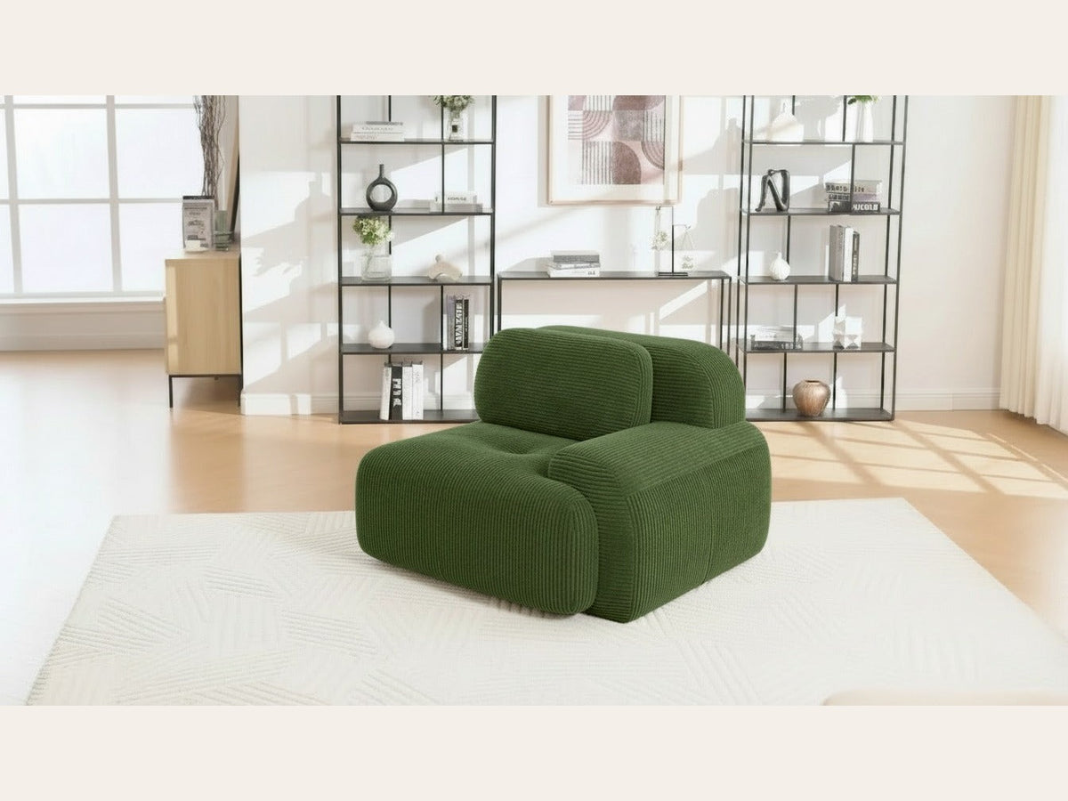 Fauteuil modulable vert, de trois quarts dans un salon