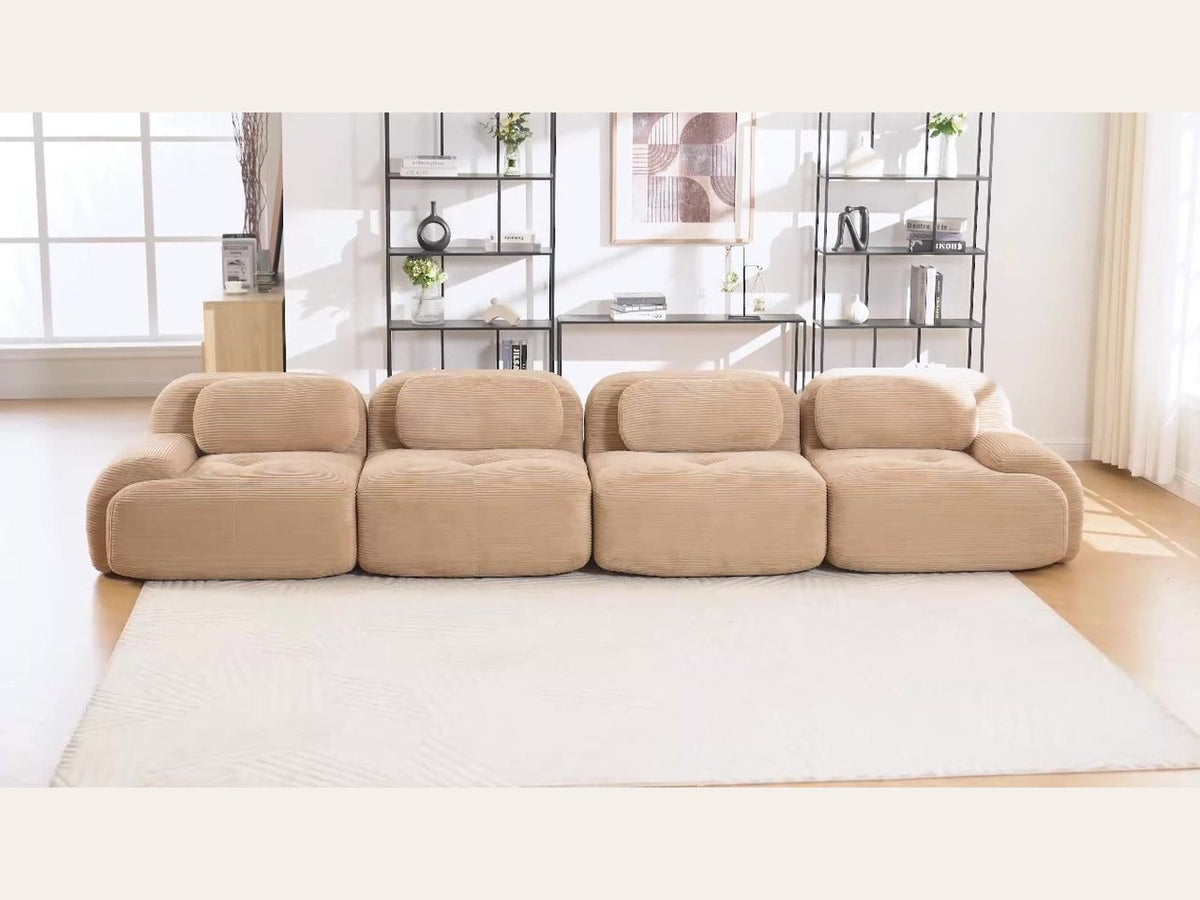 Canapé 4 places velours côtelé beige, de face dans un salon