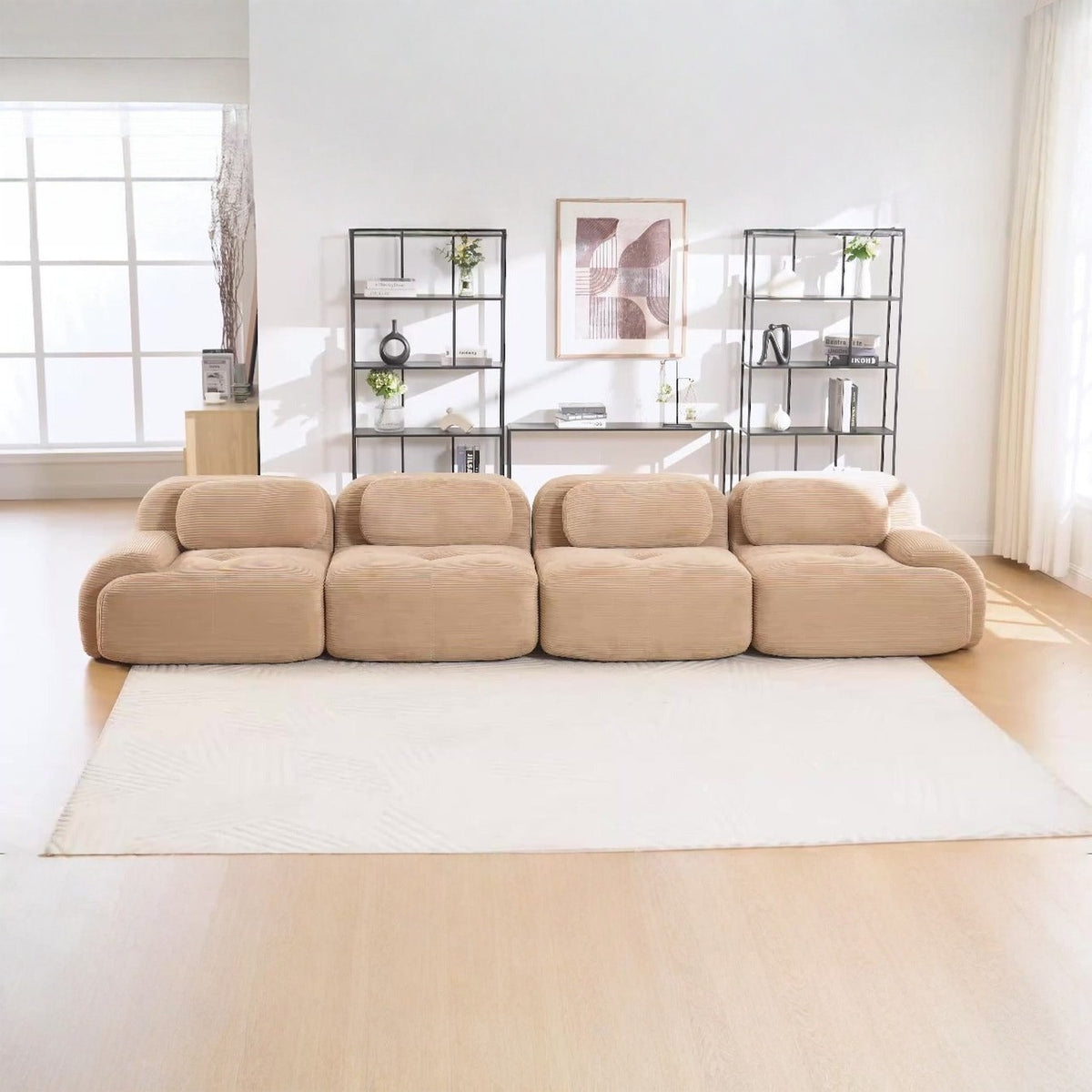 Canapé 4 places velours côtelé beige, de face dans un salon