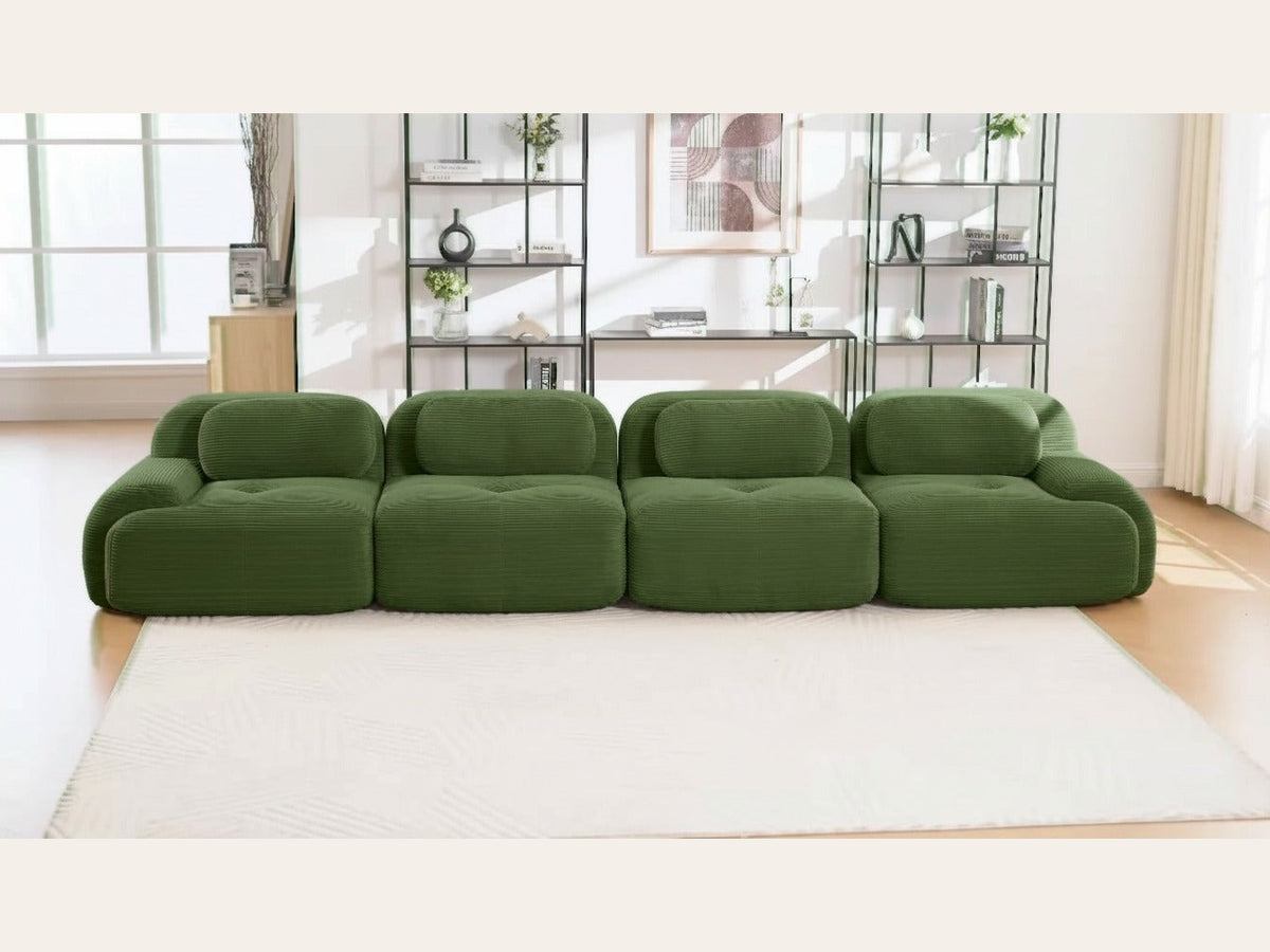 Canapé 4 places velours côtelé vert, de face dans un salon