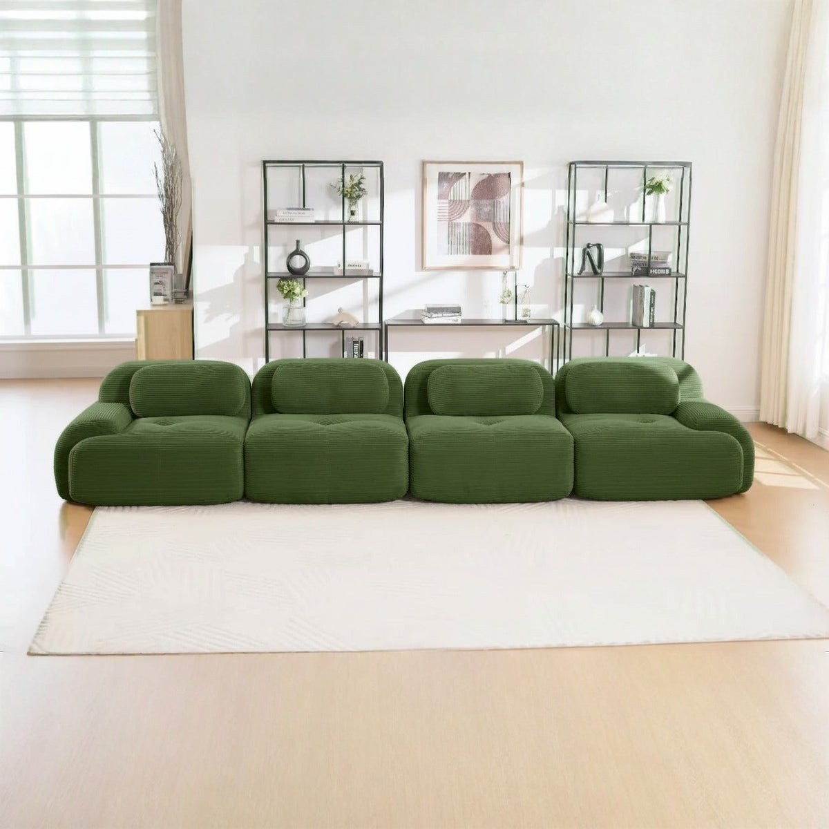 Canapé 4 places velours côtelé vert, de face dans un salon