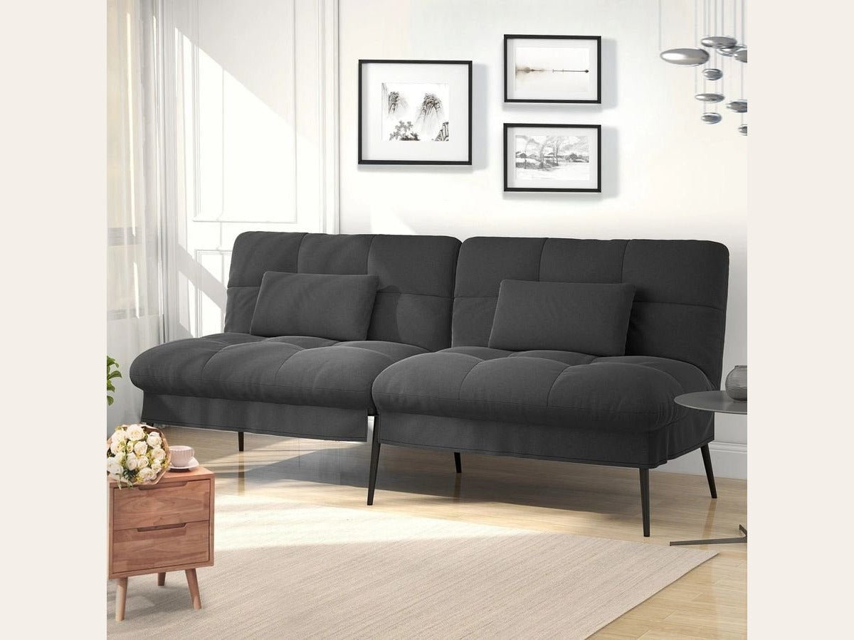 Canapé convertible en velours, coloris gris anthracite, dans une pièce