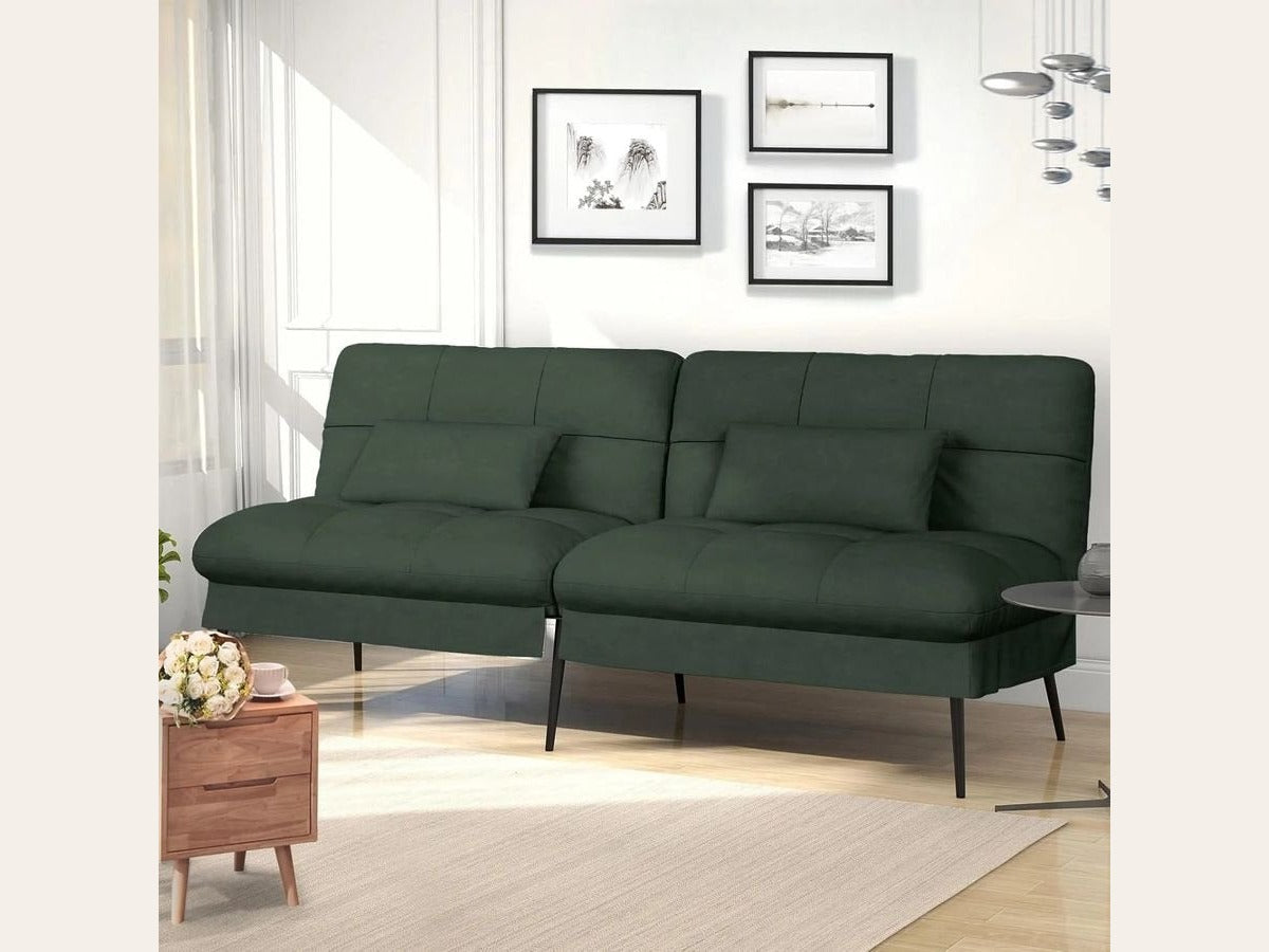 Canapé convertible en velours, coloris vert profond, dans une pièce